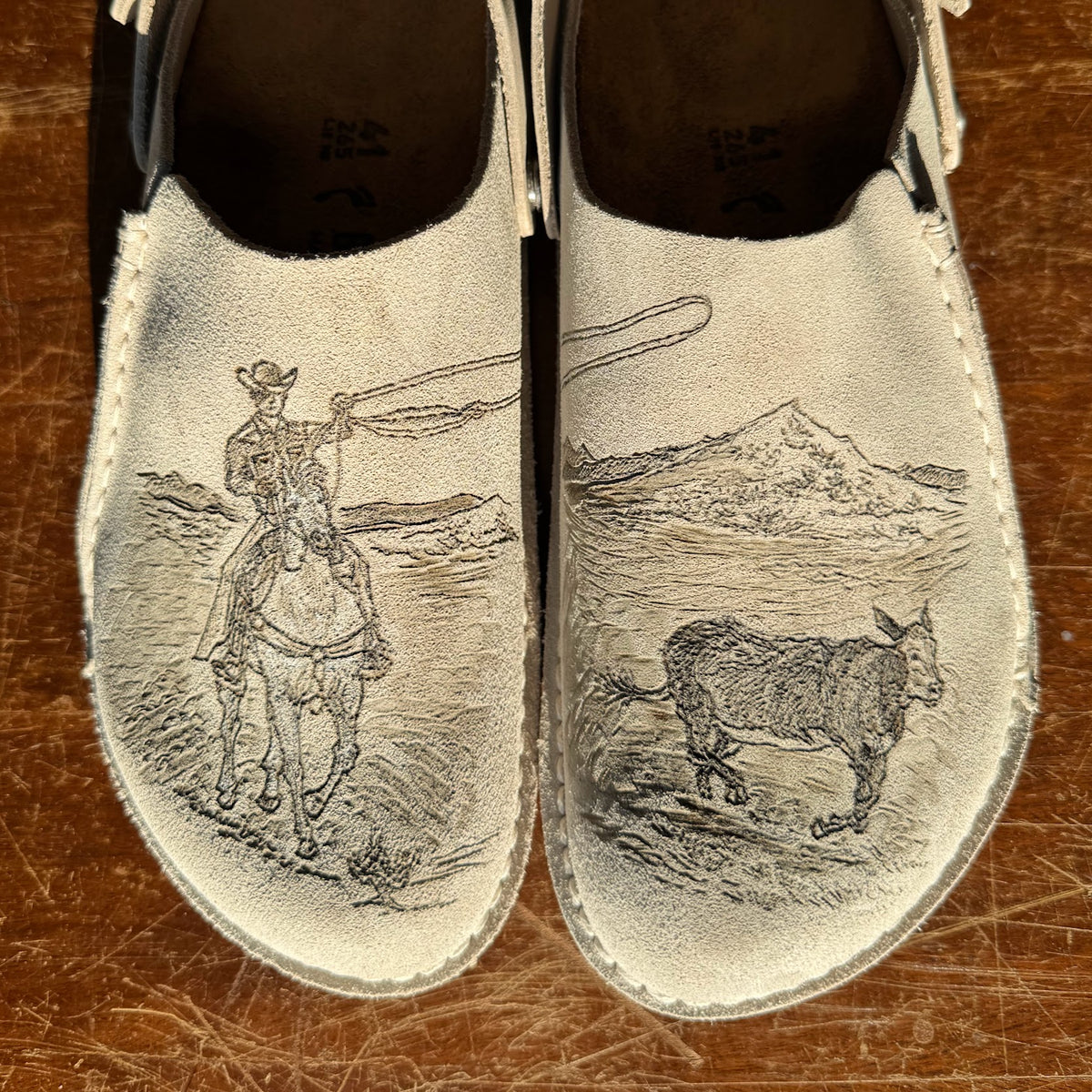 cowboy roping bull on eggshell lutry (suede leather)